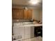 Functional laundry room with washer, dryer, and overhead cabinets at 466 Sycamore Ridge Ct, Avon, IN 46123