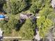 Housetop view of home nestled amongst lush green trees at 5826 Winding Way Ln, Indianapolis, IN 46220