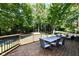 Deck with table and chairs overlooking backyard at 5826 Winding Way Ln, Indianapolis, IN 46220