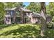 Brick two story home with a large front yard and mature trees at 5826 Winding Way Ln, Indianapolis, IN 46220