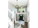 Two story foyer with a grand staircase and large windows at 5826 Winding Way Ln, Indianapolis, IN 46220