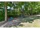 Large backyard with playset and firepit area at 5826 Winding Way Ln, Indianapolis, IN 46220