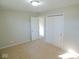 Bright bedroom with double closets and neutral walls at 109 Bixler Rd, Indianapolis, IN 46227