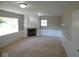 Living room featuring a fireplace and large windows at 109 Bixler Rd, Indianapolis, IN 46227