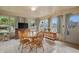 Bright sunroom features a table and chairs, offering a relaxing space at 1061 Saint Paul St, Shelbyville, IN 46176