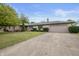 Brick ranch home with attached garage and landscaped lawn at 1061 Saint Paul St, Shelbyville, IN 46176