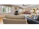 Bright living room with hardwood floors, comfy seating, and a large TV at 1061 Saint Paul St, Shelbyville, IN 46176