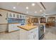 Updated kitchen featuring white cabinets, butcher block countertops, and stainless steel appliances at 1061 Saint Paul St, Shelbyville, IN 46176