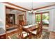 Dining room with hardwood floors and view into entryway at 3601 Ostrom Ct, Greenwood, IN 46143