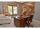 Home office with a desk, chair, and large window at 3601 Ostrom Ct, Greenwood, IN 46143