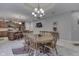 Round dining table with six chairs in a bright dining room at 5391 Neff Ln, Mooresville, IN 46158