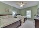 Guest bedroom with two twin beds and green walls at 5391 Neff Ln, Mooresville, IN 46158