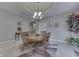 Round dining table with six chairs in a bright dining room at 5391 Neff Ln, Mooresville, IN 46158