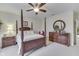Bright bedroom featuring a post bed and wooden dresser at 5391 Neff Ln, Mooresville, IN 46158