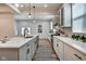 Modern kitchen with white cabinets, quartz countertops, and stainless steel appliances at 1229 N Keystone Ave, Indianapolis, IN 46201