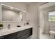 Modern bathroom with double vanity, walk-in shower, and marble flooring at 1229 N Keystone Ave, Indianapolis, IN 46201