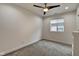 Bright bedroom with ceiling fan, carpet, and built-in shelving at 1229 N Keystone Ave, Indianapolis, IN 46201