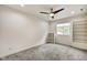 Well-lit bedroom, carpet flooring, and built-in shelving at 1229 N Keystone Ave, Indianapolis, IN 46201