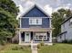 Charming two-story navy blue house with white trim at 1229 N Keystone Ave, Indianapolis, IN 46201