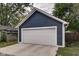 Detached two-car garage with white door at 1229 N Keystone Ave, Indianapolis, IN 46201