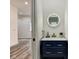 Stylish powder room with navy vanity and a sleek mirror at 1229 N Keystone Ave, Indianapolis, IN 46201