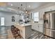 Modern kitchen with white cabinets, stainless steel appliances, and an island at 1229 N Keystone Ave, Indianapolis, IN 46201
