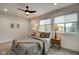 Bright bedroom with two nightstands and a ceiling fan at 1229 N Keystone Ave, Indianapolis, IN 46201