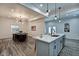 Open kitchen with an island, stainless steel appliances, and dining area at 1229 N Keystone Ave, Indianapolis, IN 46201