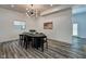 Bright dining room featuring a dark wood table and six chairs at 1229 N Keystone Ave, Indianapolis, IN 46201