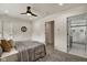 Spacious bedroom with ensuite bathroom access and ceiling fan at 1229 N Keystone Ave, Indianapolis, IN 46201