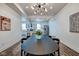 Open concept dining room with view into modern kitchen at 1229 N Keystone Ave, Indianapolis, IN 46201