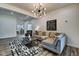 Open living area featuring a gray sectional and kitchen view at 1229 N Keystone Ave, Indianapolis, IN 46201