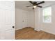 Spacious bedroom featuring hardwood floors and ceiling fan at 309 N Lasalle St, Indianapolis, IN 46201