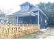Charming house with a newly renovated exterior and picket fence at 309 N Lasalle St, Indianapolis, IN 46201