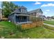 Charming blue home with a white picket fence and covered porch at 309 N Lasalle St, Indianapolis, IN 46201
