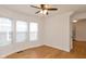 Living room with hardwood floors, large windows, and a ceiling fan at 309 N Lasalle St, Indianapolis, IN 46201
