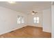 Spacious living room featuring hardwood floors and a ceiling fan at 309 N Lasalle St, Indianapolis, IN 46201
