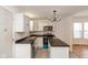 Modern kitchen with white cabinets, island, and stainless steel appliances at 309 N Lasalle St, Indianapolis, IN 46201