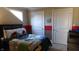 bedroom with vehicle-themed bedding and red accent wall at 10781 Cedar Ridge Ln, Brownsburg, IN 46278