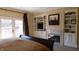 Main bedroom with a fireplace, built-in shelving, and a king bed at 10781 Cedar Ridge Ln, Brownsburg, IN 46278