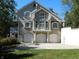Three-car garage and a large house with multiple windows at 10781 Cedar Ridge Ln, Brownsburg, IN 46278