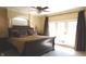 Relaxing main bedroom with a king-size bed and access to a balcony at 10781 Cedar Ridge Ln, Brownsburg, IN 46278
