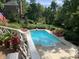 Inviting in-ground pool with surrounding patio and lush landscaping at 10781 Cedar Ridge Ln, Brownsburg, IN 46278