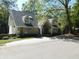 Tan brick house with gray roof, columns, and landscaping at 10781 Cedar Ridge Ln, Brownsburg, IN 46278