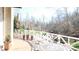 Deck overlooking a wooded area with table and chairs at 10781 Cedar Ridge Ln, Brownsburg, IN 46278