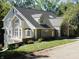 Tan brick house with gray roof, columns, and landscaping at 10781 Cedar Ridge Ln, Brownsburg, IN 46278