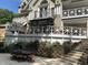 Home features a large deck, patio, retaining wall, and landscaping at 10781 Cedar Ridge Ln, Brownsburg, IN 46278