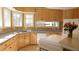 Bright kitchen features ample cabinetry, corner windows, and an island at 10781 Cedar Ridge Ln, Brownsburg, IN 46278