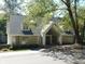 Tan brick house with gray roof, columns, and landscaping at 10781 Cedar Ridge Ln, Brownsburg, IN 46278