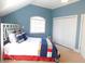 Blue bedroom with double doors and a bed at 10781 Cedar Ridge Ln, Brownsburg, IN 46278